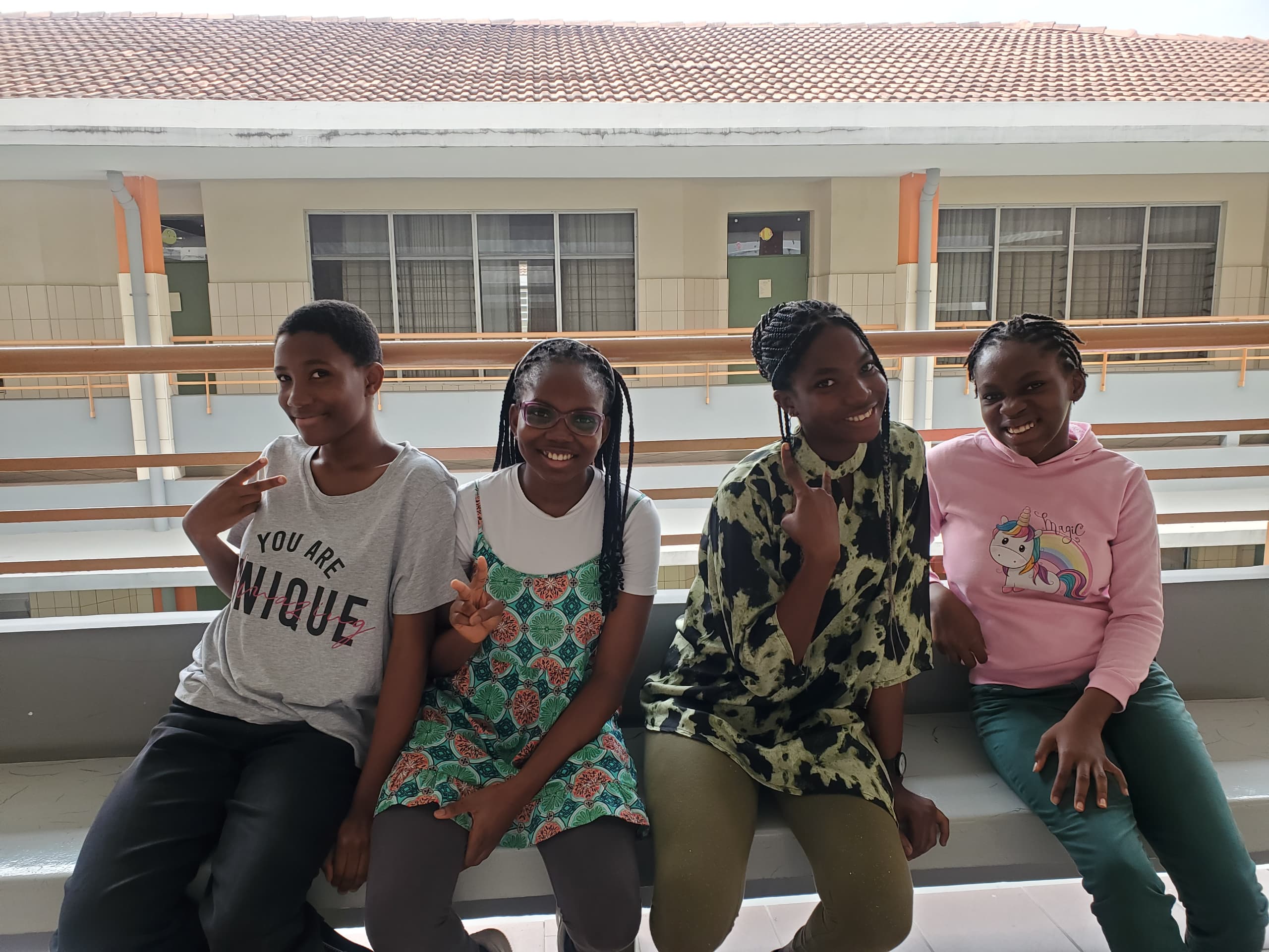 Friends sitting together on the balcony